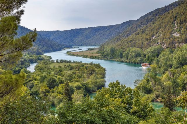 Krka National Park is renowned for its breathtaking waterfalls, which cascade down from the Krka River 